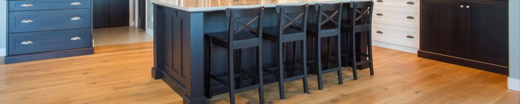 hardwood floors in traditional style kitchen with blue cupboards in Colorado Springs, CO at IQ Floors