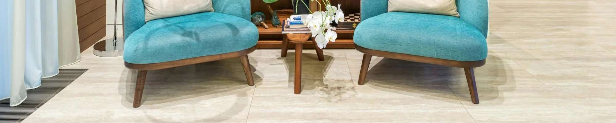 reading nook with blue chairs and wooden bookcase in Colorado Springs, CO at IQ Floors