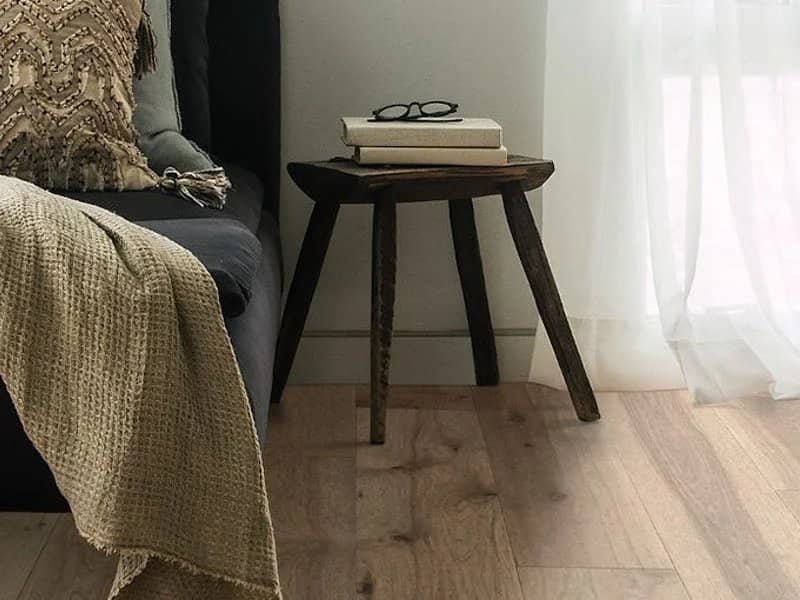 hardwood flooring with small side table in Colorado Springs, CO at IQ Floors | 3350 Fillmore Ridge Heights, Colorado Springs, CO 80907